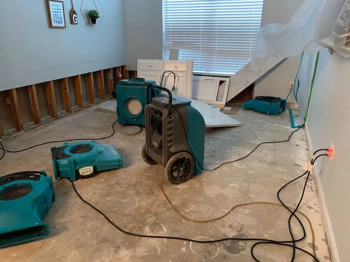 Dehumidifier in flood-cut room for Water Damage Restoration in Mequon